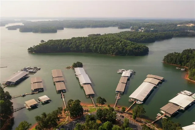 an aerial view of residential building and lake