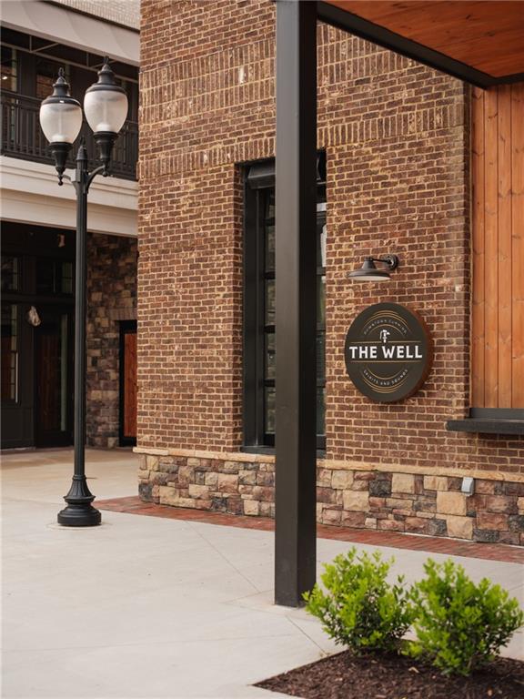 530 Alice Way, Unit D7 Cumming, GA 30040 - Photo 52 of 56 a front view of a building with garden