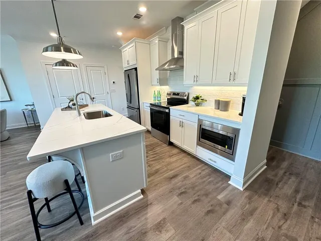 a kitchen with wooden cabinets and white appliances