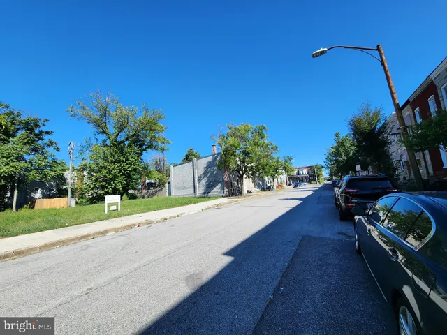 a swimming pool with outdoor seating and yard