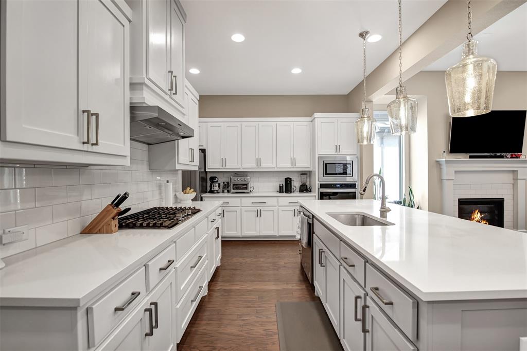 1026 Billy Lane Allen, TX 75013 - Photo 11 of 32 a kitchen with a sink stove cabinets and refrigerator