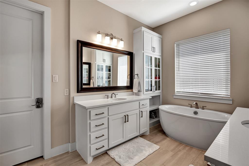 1026 Billy Lane Allen, TX 75013 - Photo 21 of 32 a bathroom with a large tub sink and mirror