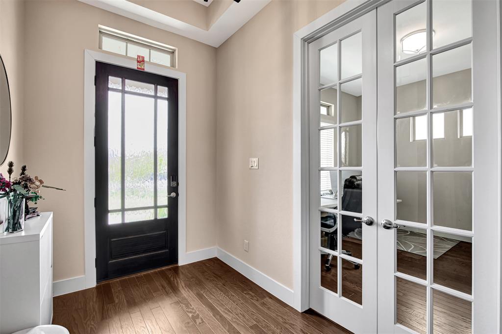 1026 Billy Lane Allen, TX 75013 - Photo 4 of 32 a view of an entryway with wooden floor and front door