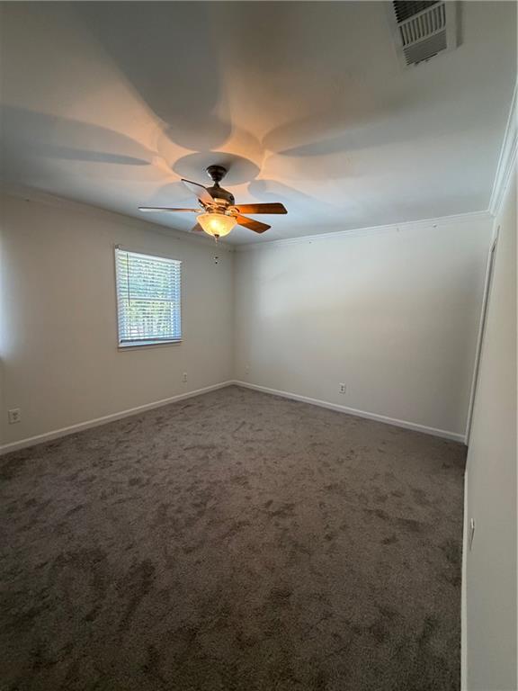 2912 Webb Bridge Road Alpharetta, GA 30009 - Photo 9 of 12 an empty room with windows and fan