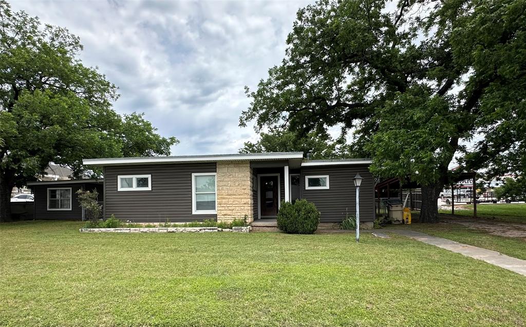 7350 Highway 67, Unit 377N Comanche, TX 76442 - Photo 3 of 13 a view of a house with a garden
