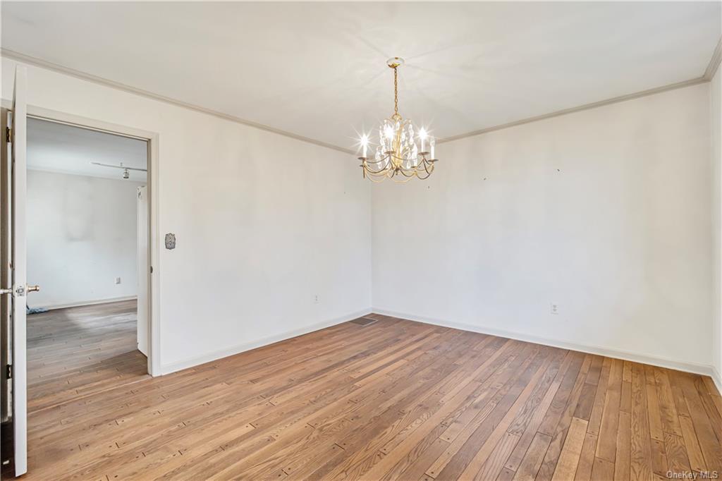461 East Mountain Road North Cold Spring, NY 10516 - Photo 12 of 29 a view of empty room with wooden floor and chandelier