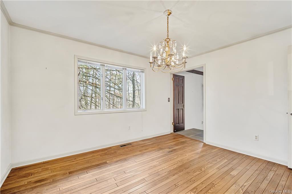 461 East Mountain Road North Cold Spring, NY 10516 - Photo 13 of 29 a view of a room with wooden floor and chandelier