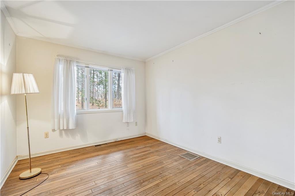 461 East Mountain Road North Cold Spring, NY 10516 - Photo 14 of 29 an empty room with wooden floor and windows