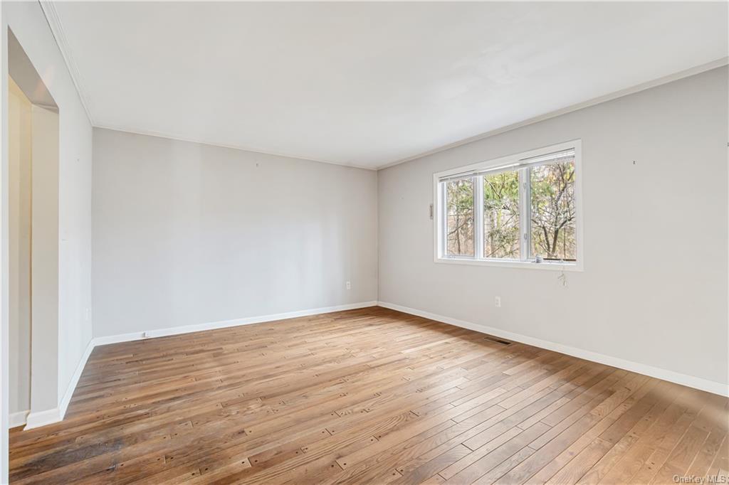 461 East Mountain Road North Cold Spring, NY 10516 - Photo 19 of 29 an empty room with wooden floor and windows