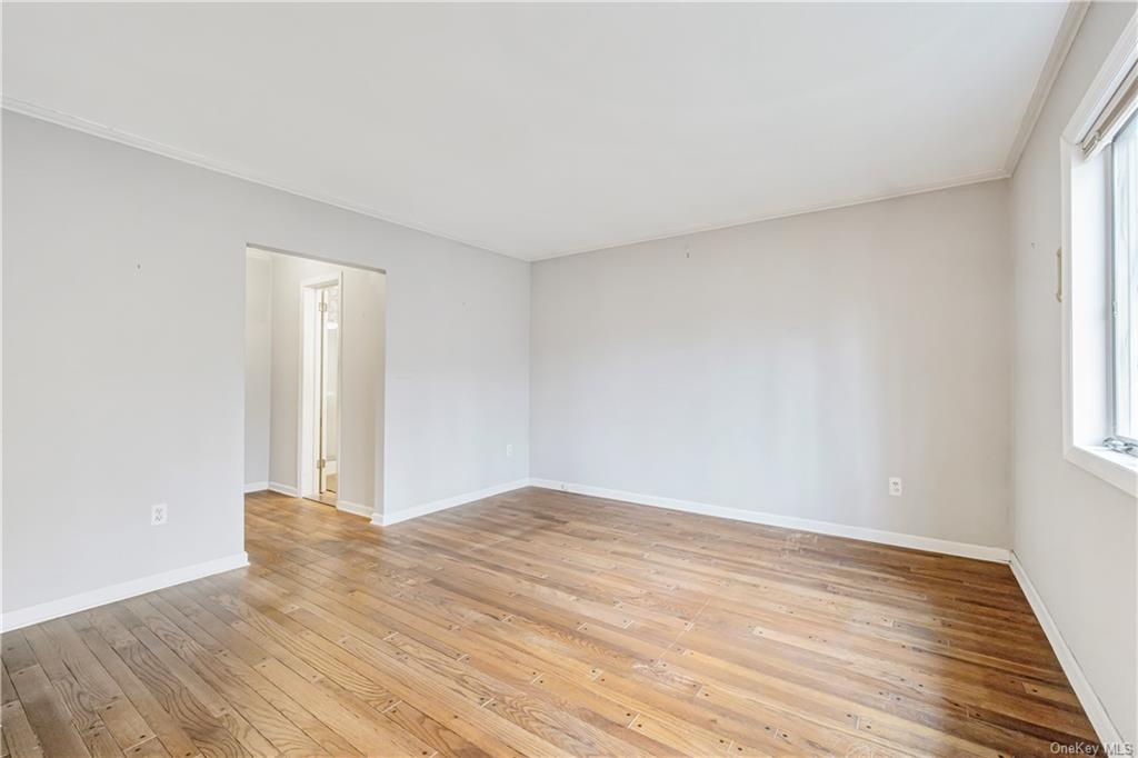 461 East Mountain Road North Cold Spring, NY 10516 - Photo 20 of 29 a view of an empty room with wooden floor and a window