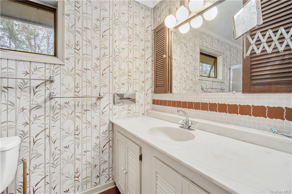 461 East Mountain Road North Cold Spring, NY 10516 - Photo 22 of 29 a bathroom with a sink and a mirror