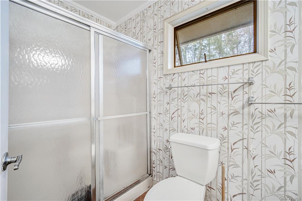461 East Mountain Road North Cold Spring, NY 10516 - Photo 23 of 29 a white toilet sitting next to a shower curtain