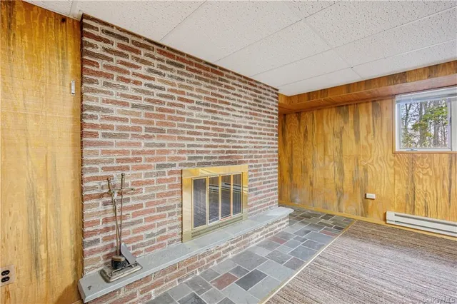 a view of a porch with wooden floor and a door