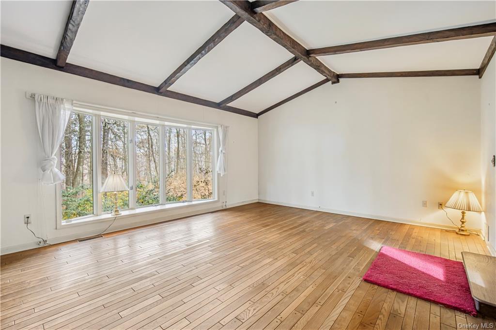 461 East Mountain Road North Cold Spring, NY 10516 - Photo 10 of 29 a view of a bedroom with wooden floor and windows