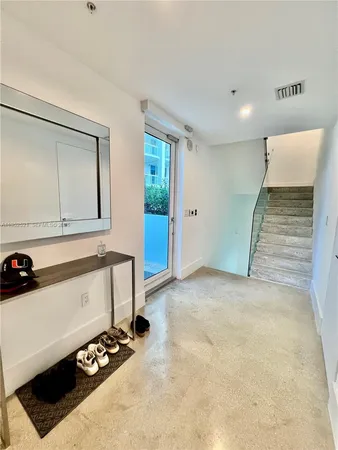 a view of room with furniture and air hockey table