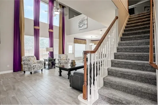 a view of entryway and hall with wooden floor