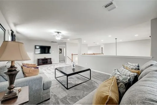 a living room with furniture and a couch