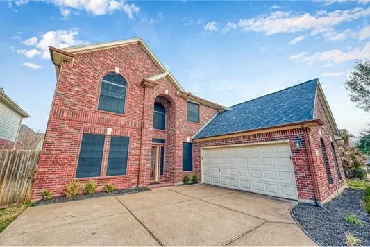 a front view of a house with a garage