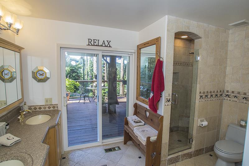 223 Ridge Road Woodside, CA 94062 - Photo 17 of 27 a bathroom with a granite countertop sink toilet and shower