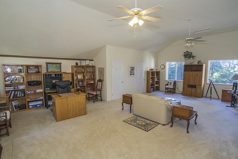 223 Ridge Road Woodside, CA 94062 - Photo 19 of 27 a living room with furniture and a window