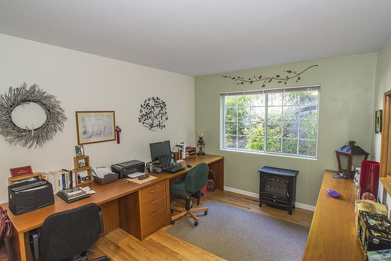 223 Ridge Road Woodside, CA 94062 - Photo 22 of 27 a view of a workspace with furniture and a window