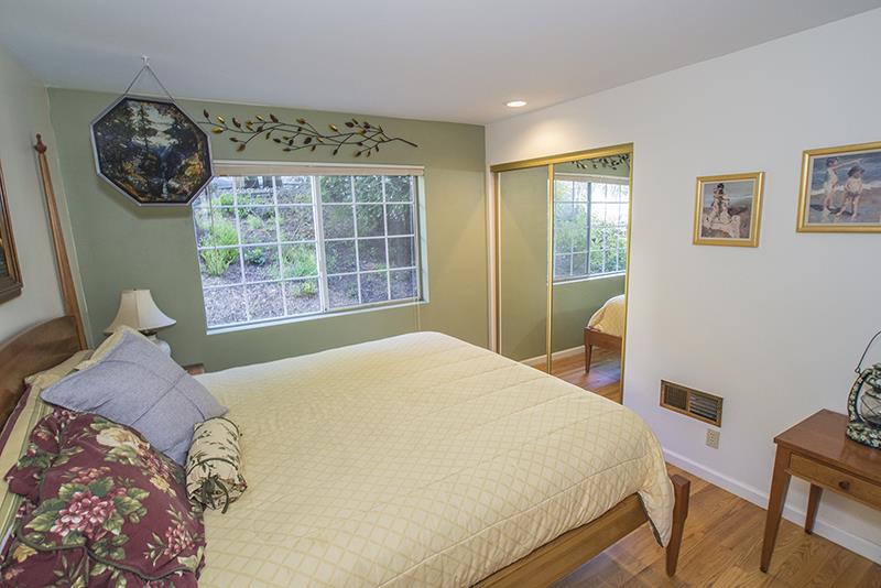 223 Ridge Road Woodside, CA 94062 - Photo 23 of 27 a bedroom with a bed and a window
