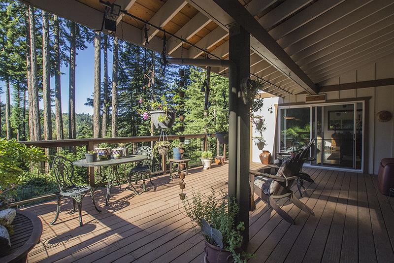 223 Ridge Road Woodside, CA 94062 - Photo 25 of 27 a view of a chairs and table in patio with wooden floor