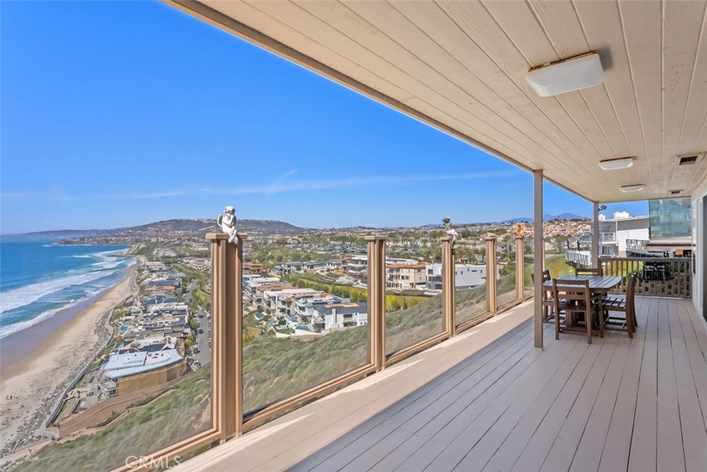 34381 Dana Strand Road Dana Point, CA 92629 - Photo 13 of 68 a view of a balcony with chairs and wooden floor
