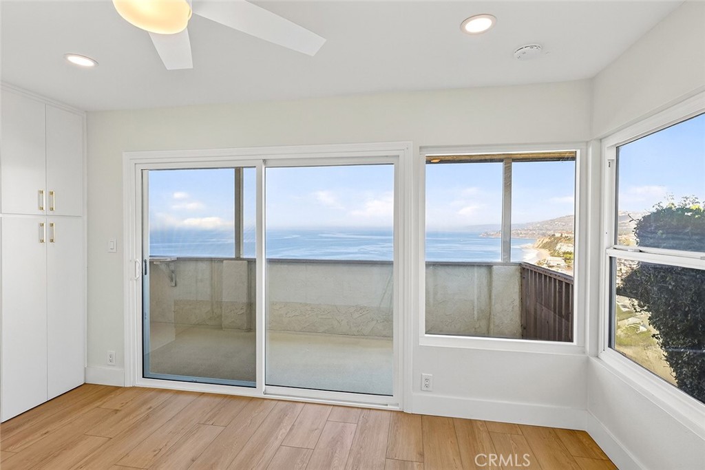 34381 Dana Strand Road Dana Point, CA 92629 - Photo 40 of 68 a view of an empty room with wooden floor and a window