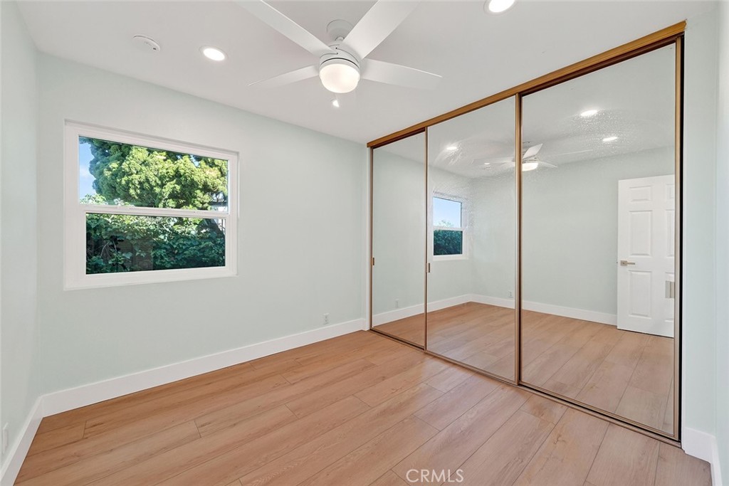34381 Dana Strand Road Dana Point, CA 92629 - Photo 43 of 68 a view of an empty room with window and a chandelier fan