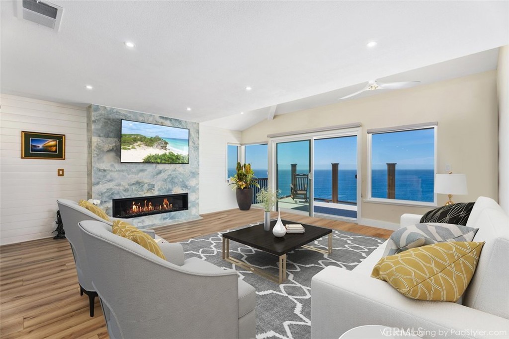 34381 Dana Strand Road Dana Point, CA 92629 - Photo 10 of 68 a living room with furniture and a flat screen tv