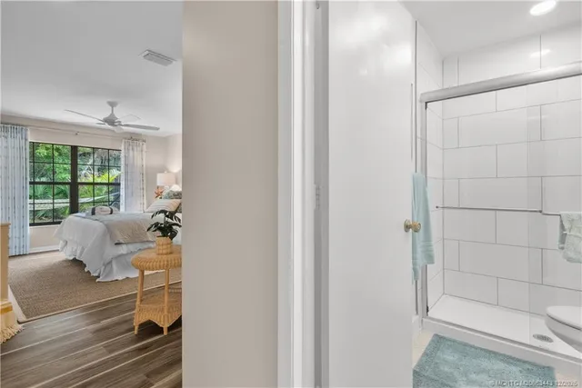 a room with a baby crib furniture and a window