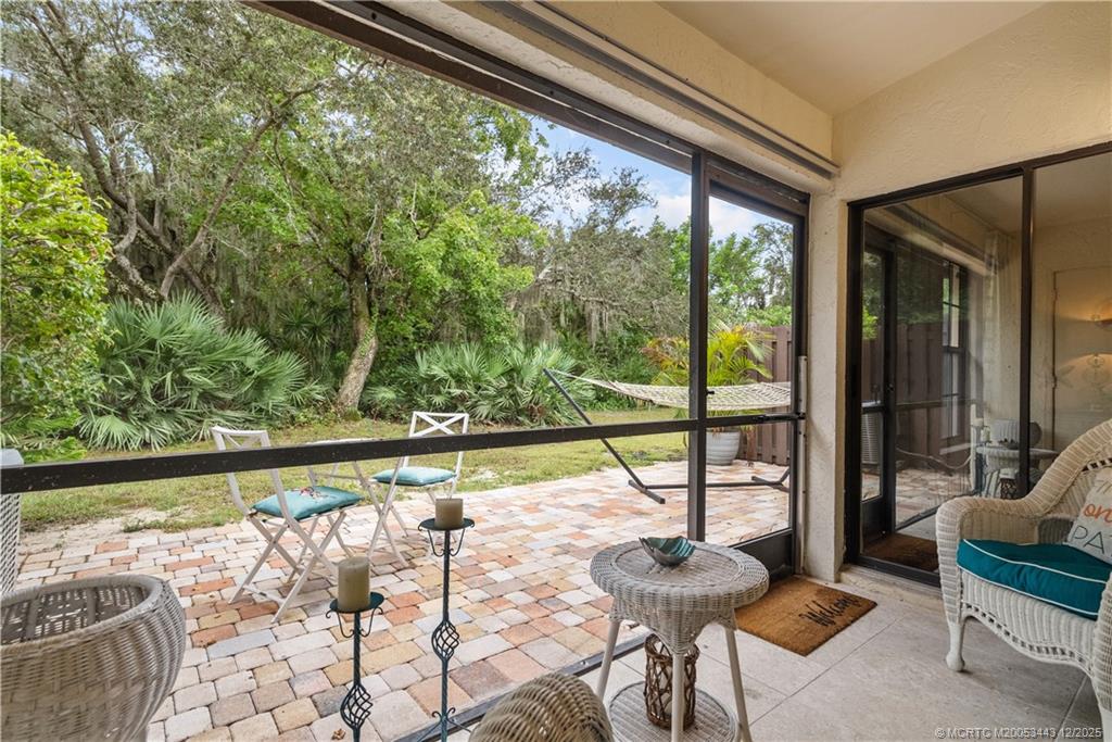 1544 Southwest Silver Pine Way, Unit 104F Palm City, FL 34990 - Photo 28 of 49 a view of a living room and floor to ceiling window or wooden floor