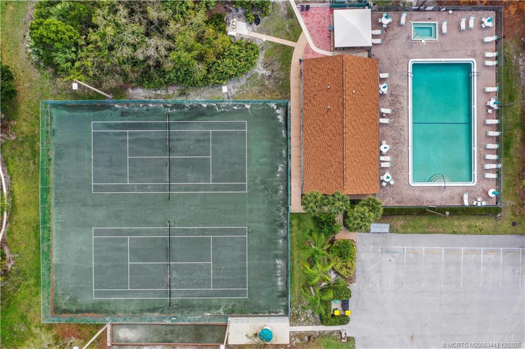 1544 Southwest Silver Pine Way, Unit 104F Palm City, FL 34990 - Photo 36 of 49 a front view of a house with a yard