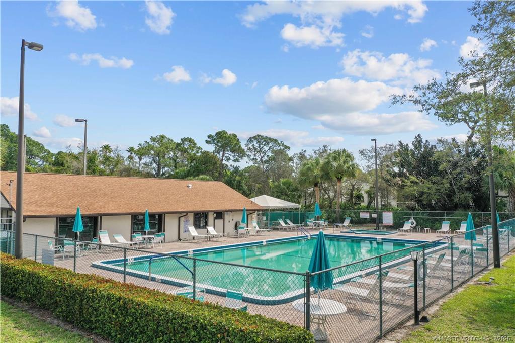 1544 Southwest Silver Pine Way, Unit 104F Palm City, FL 34990 - Photo 38 of 49 a view of a terrace with chairs