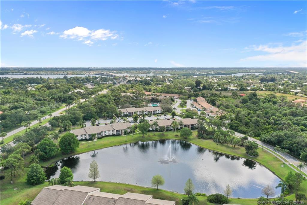 1544 Southwest Silver Pine Way, Unit 104F Palm City, FL 34990 - Photo 40 of 49 an aerial view of a house with a lake view