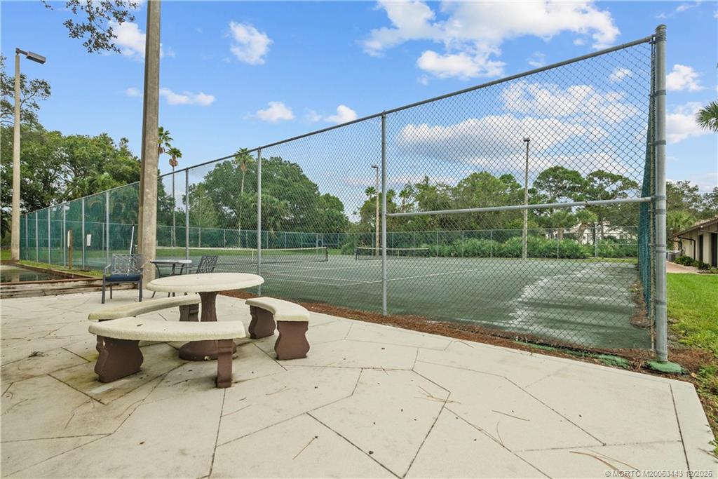 1544 Southwest Silver Pine Way, Unit 104F Palm City, FL 34990 - Photo 45 of 49 a garden view with a sitting space