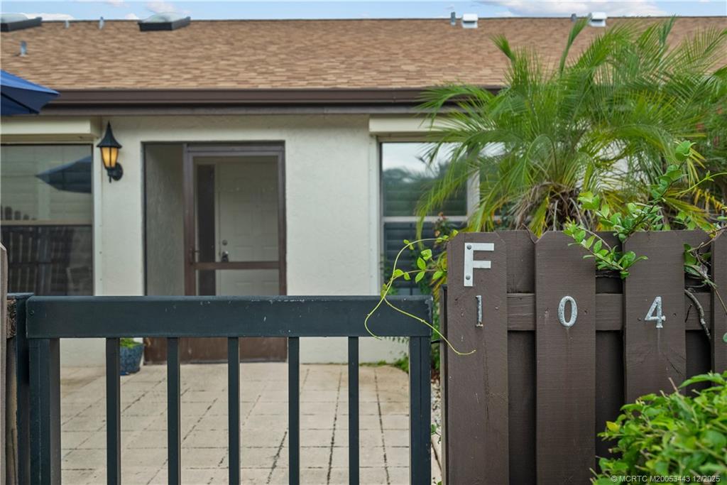 1544 Southwest Silver Pine Way, Unit 104F Palm City, FL 34990 - Photo 6 of 49 a house view with a garden space