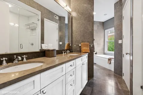 a bathroom with a granite countertop sink mirror and double