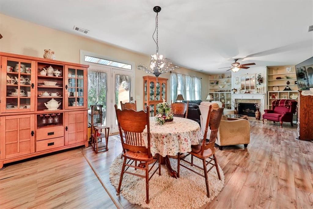 176 Oakland Way Dallas, GA 30157 - Photo 19 of 74 a view of a dining room with furniture and wooden floor