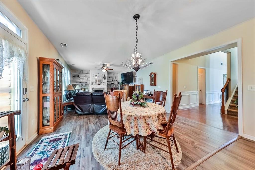 176 Oakland Way Dallas, GA 30157 - Photo 20 of 74 a view of a dining room with furniture and wooden floor