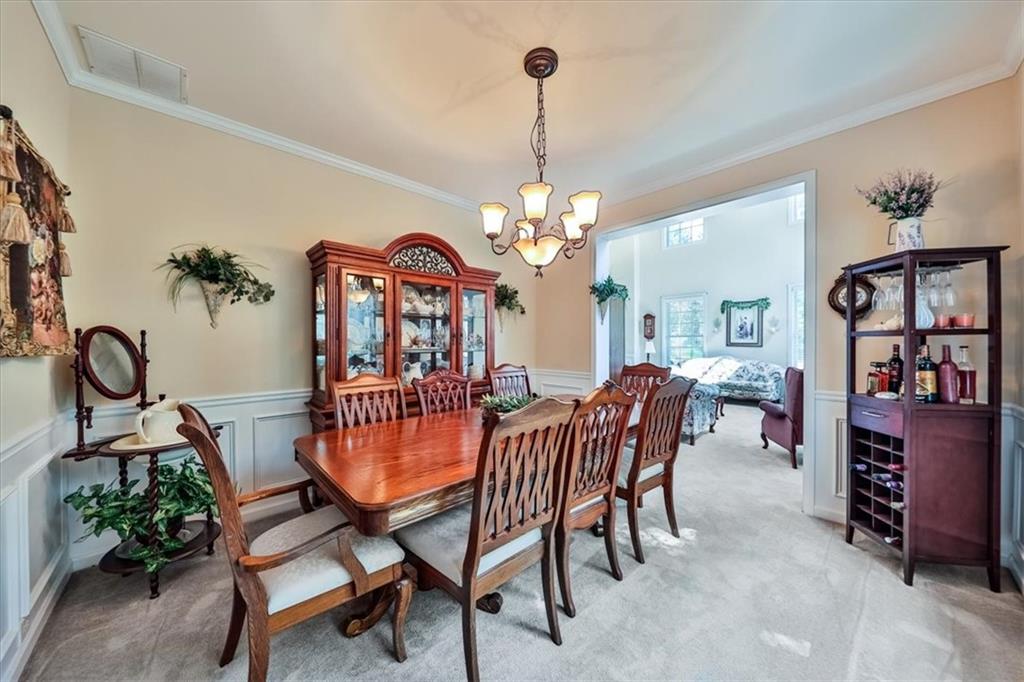 176 Oakland Way Dallas, GA 30157 - Photo 27 of 74 a view of a dining room with furniture and chandelier