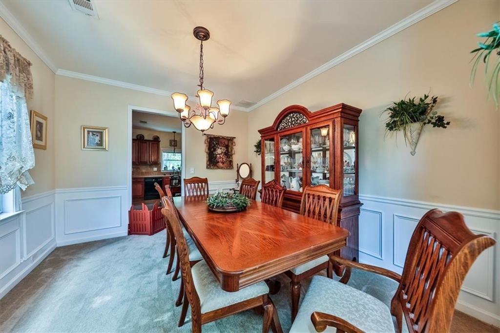 176 Oakland Way Dallas, GA 30157 - Photo 28 of 74 a view of a dining room with furniture and chandelier