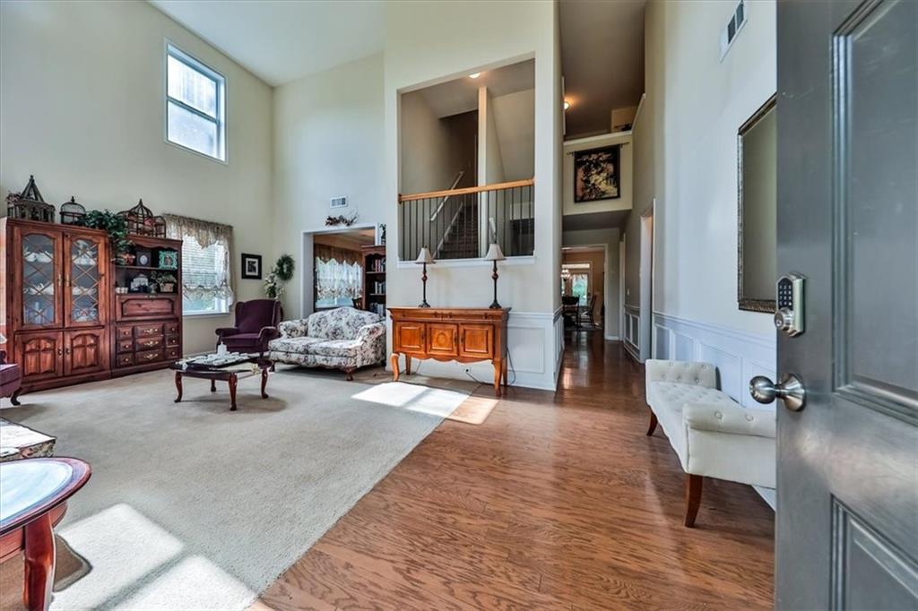 176 Oakland Way Dallas, GA 30157 - Photo 5 of 74 a living room with furniture and a fireplace