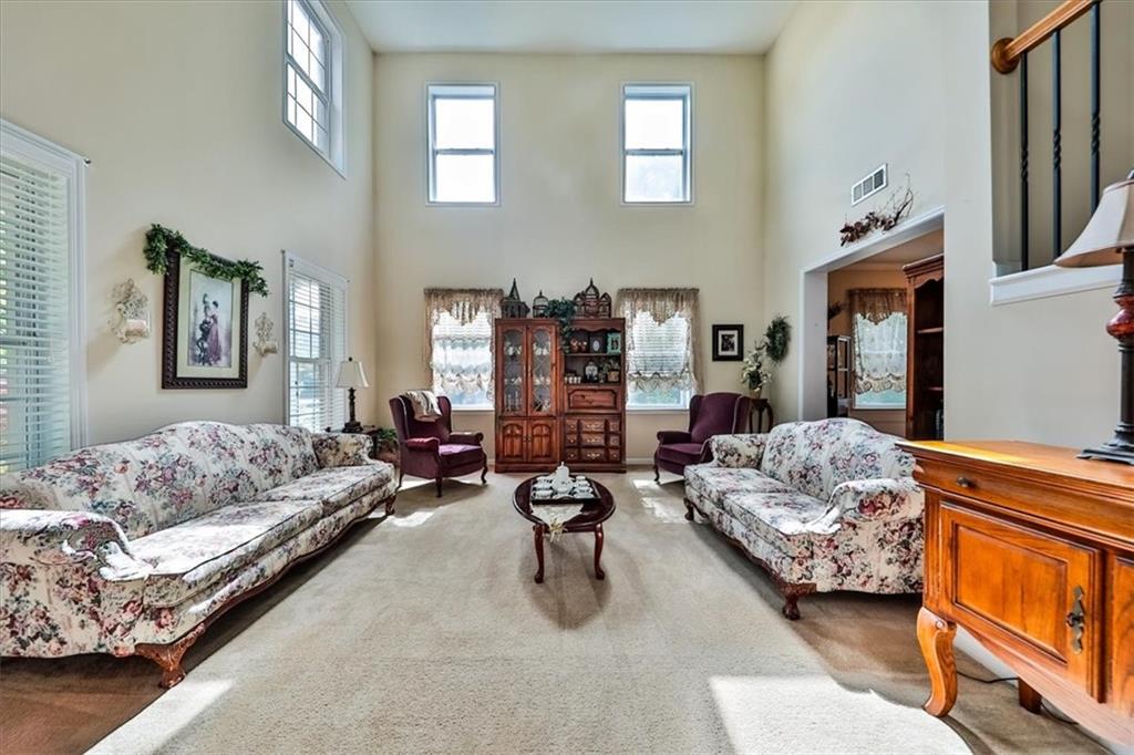 176 Oakland Way Dallas, GA 30157 - Photo 6 of 74 a living room with furniture and a couch