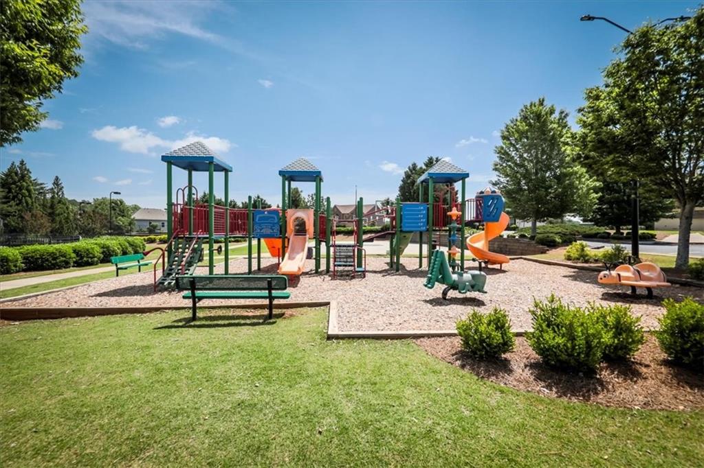 176 Oakland Way Dallas, GA 30157 - Photo 68 of 74 a view of a park with swings and slides