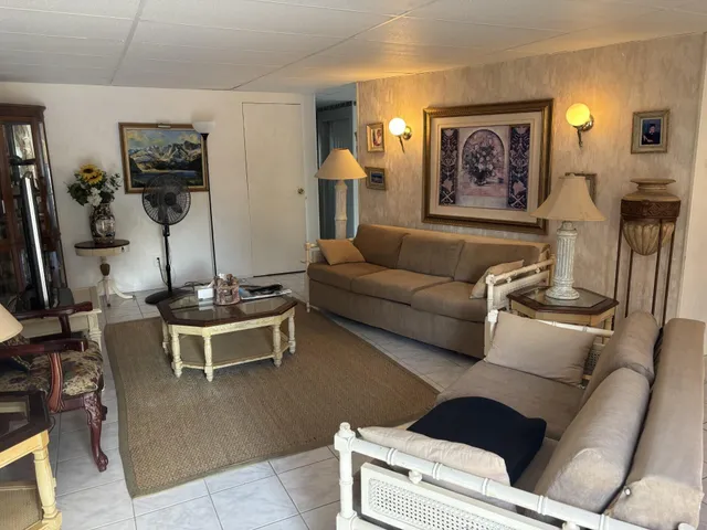 a view of a dining room with furniture and window