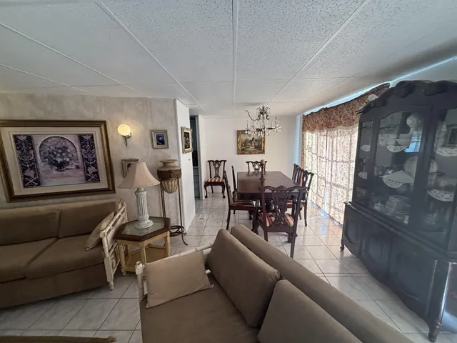 a kitchen with a table and chairs in it