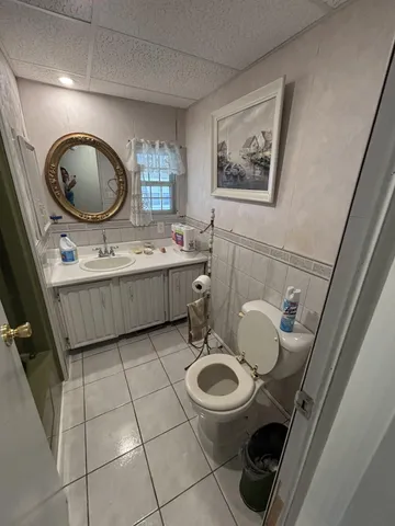 a view of backyard of house with green space