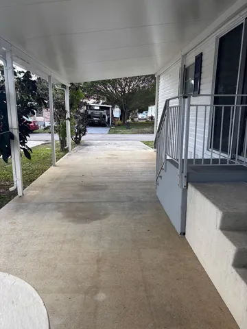 a living room with furniture a rug and a window